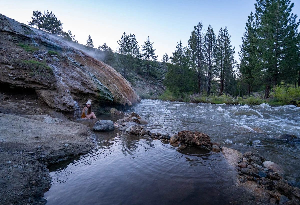 Woman sitting in Buckeye Hot Springs along Buckeye Creek