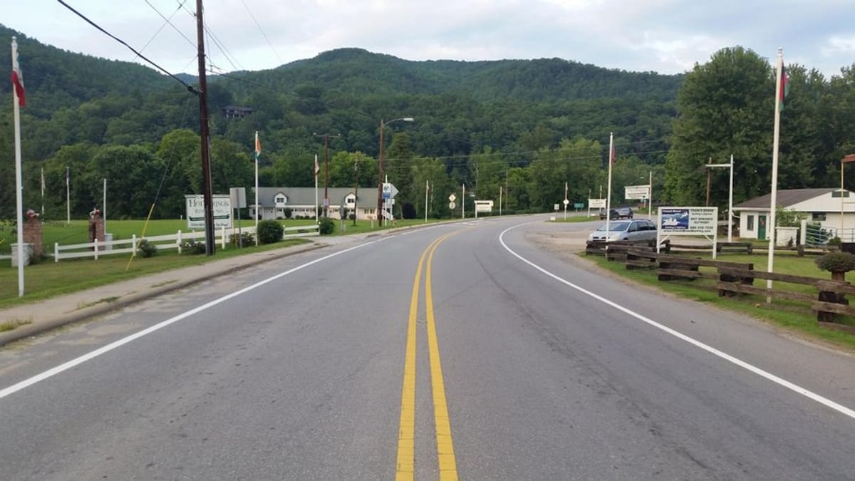 Standing in the road with campsite entrance on my right and resort and spa entrance on my left.
