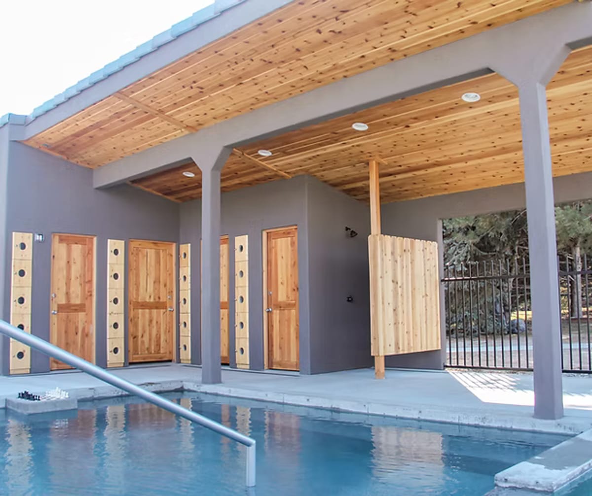 View of the changing rooms from one of the outdoor pools. 